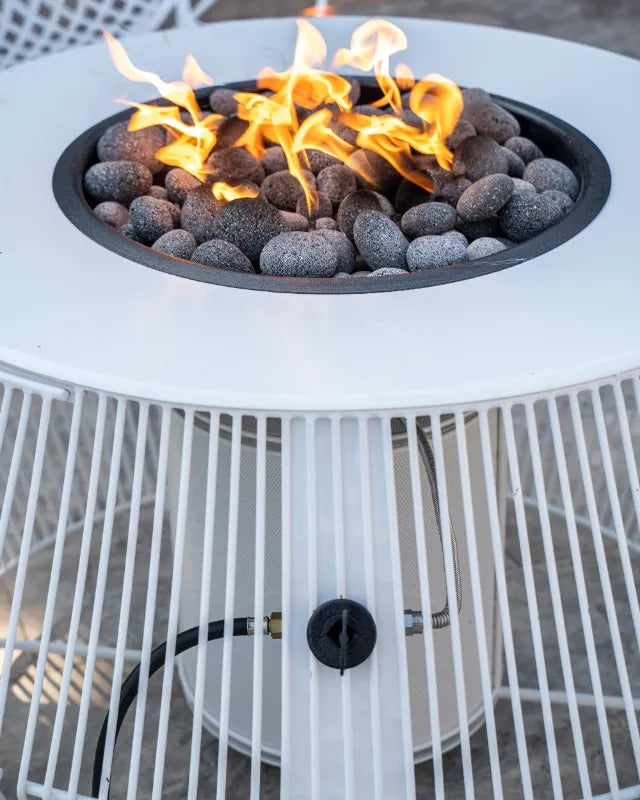 The Outdoor Plus Cesto fire pit white powder coat flame close
