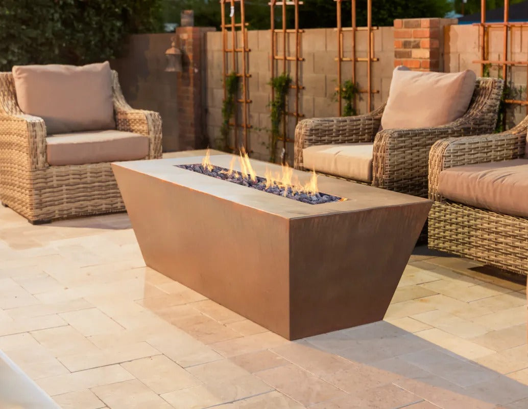 The Outdoor Plus Mesa fire pit on a beautiful patio