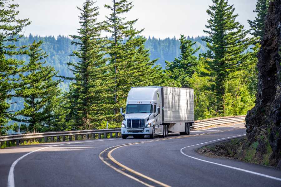 Transport hauling load in mountains