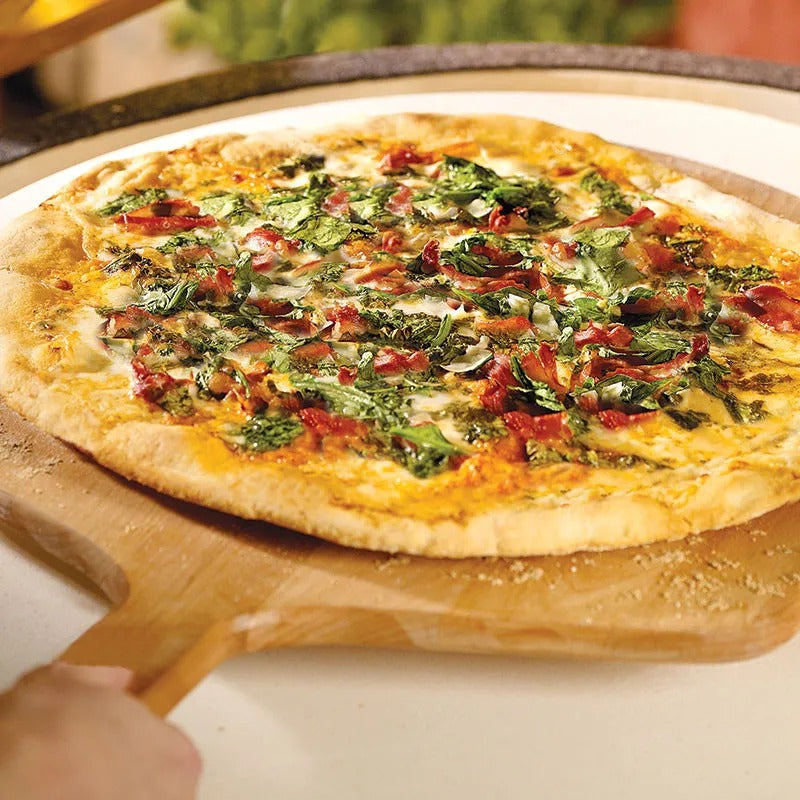 Big Green Egg pizza on wood peel stone