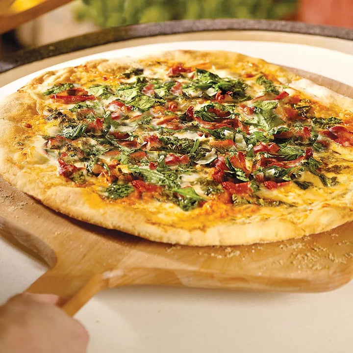 Big Green Egg pizza on wood peel stone