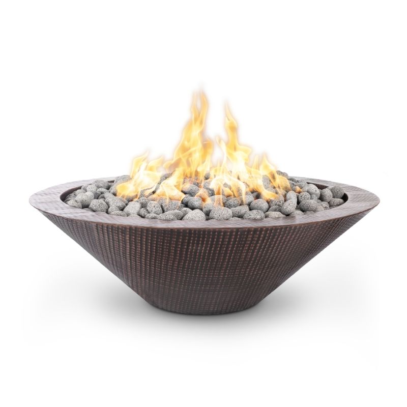 Cazo fire bowl pit with a narrow lip made of copper with a hammered patina.