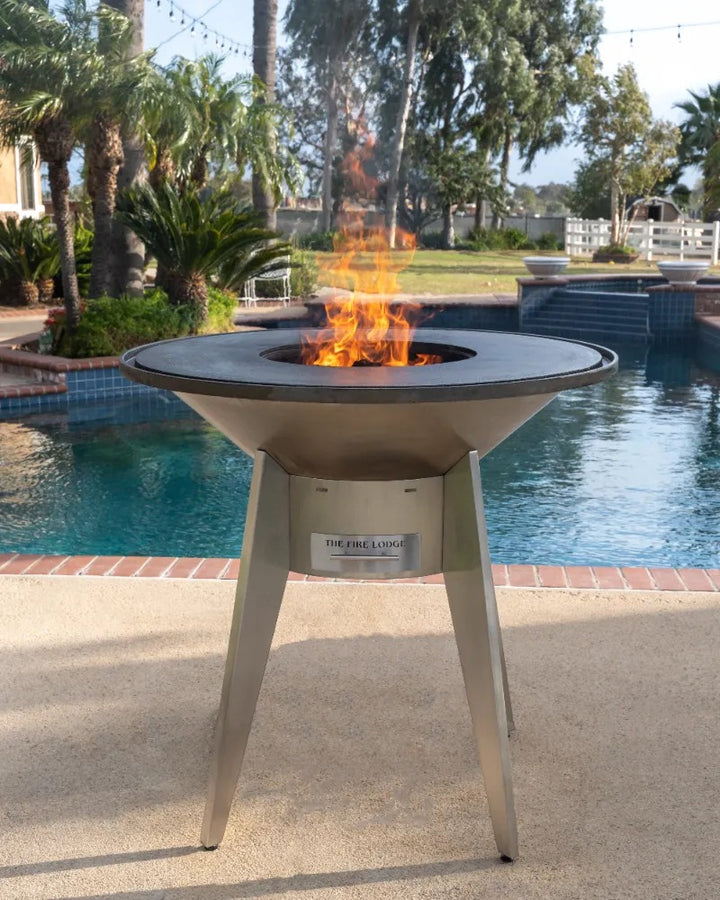 A stainless steel Mojave Grill ready to grill by the pool. 