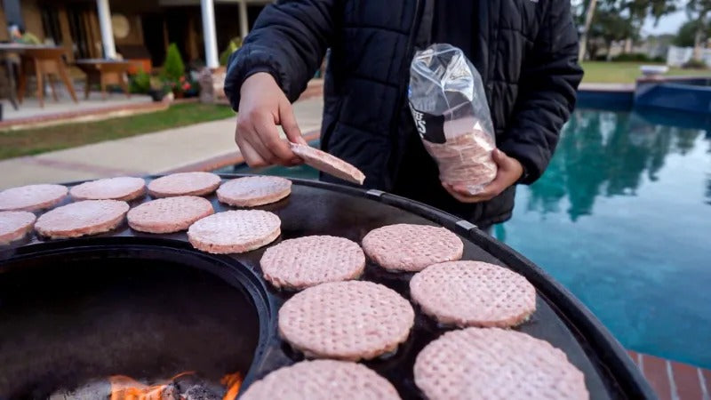 Cooking up a lot of hamburger patties on a Mojave grill.