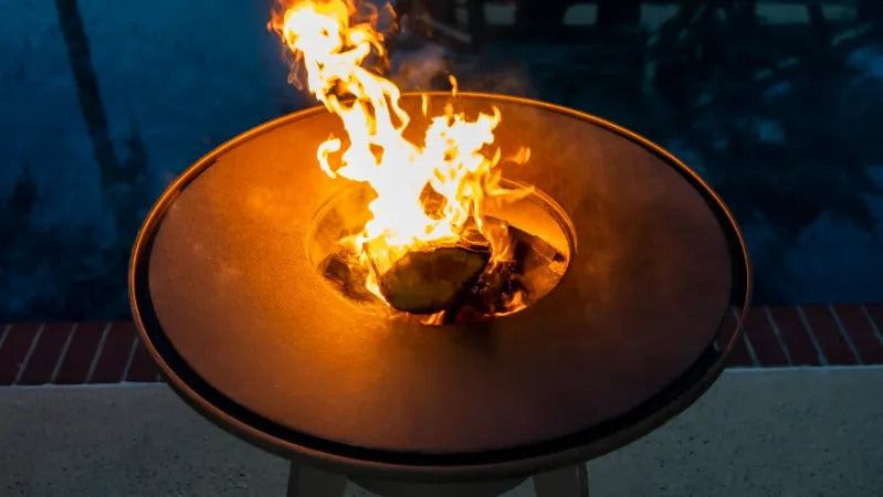 A top view of tall flames coming out of a Mojave grill.