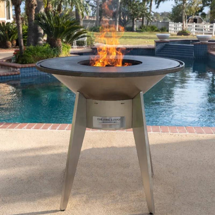 A Mojave stainless steel grill fired up and ready to cook poolside.