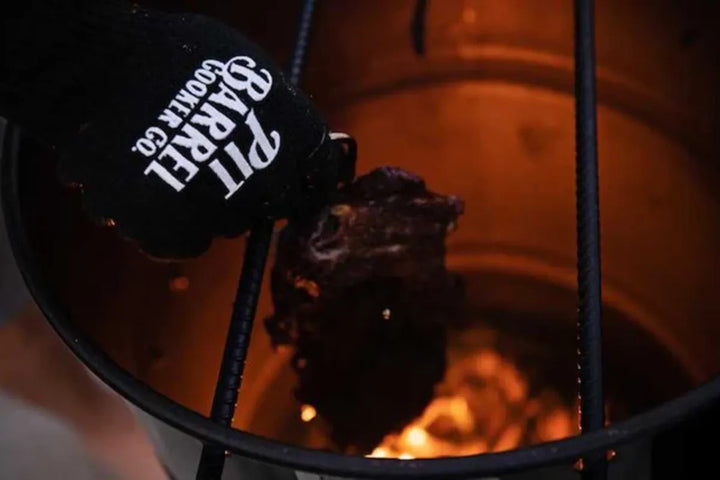 Pit Barrel Cooker Gloves Pit Grips handling a hot hook