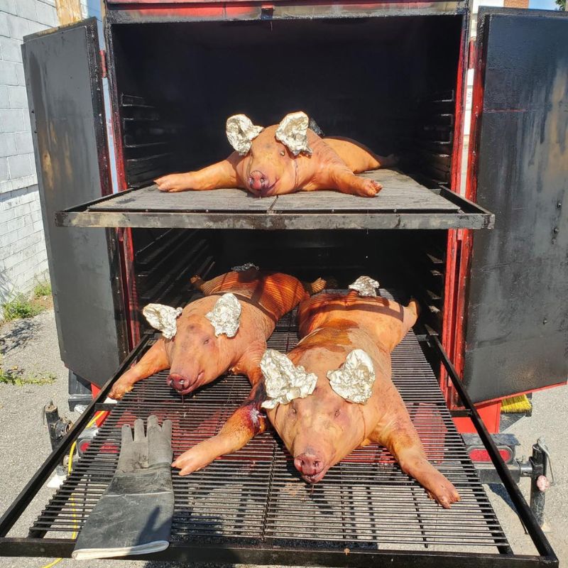Smokin Brothers Commercial Big Red cooking pigs