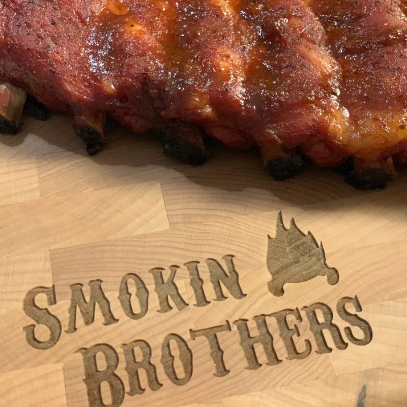 Smokin Brothers maple cutting board BBQ ribs