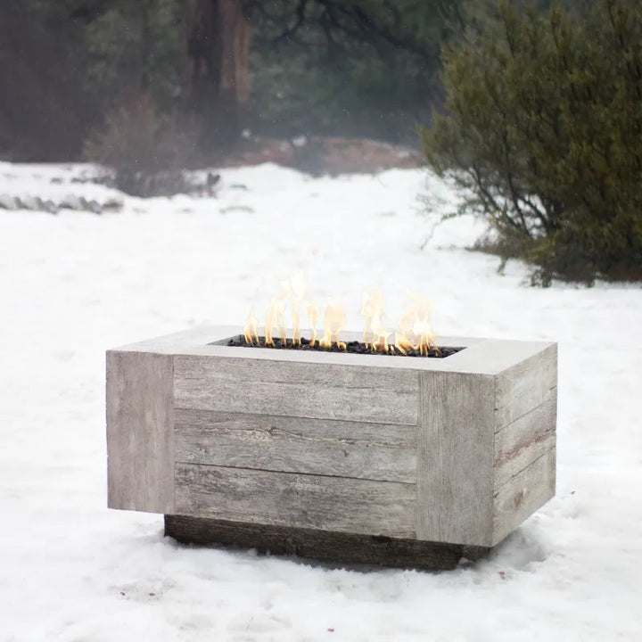 The Outdoor Plus Catalina fire pit ivory wood grain in the snow