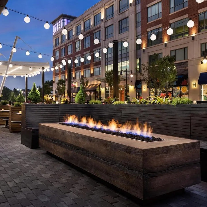 The Outdoor Plus Catalina fire pit oak wood grain urban setting