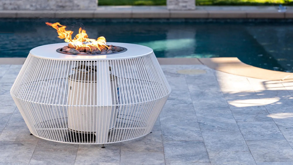 The Outdoor Plus Cesto fire pit white powder coat poolside