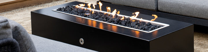 The Outdoor Plus Regal Fire Pit lit up