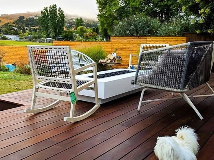 The Outdoor Plus white Coronado fire pit on patio