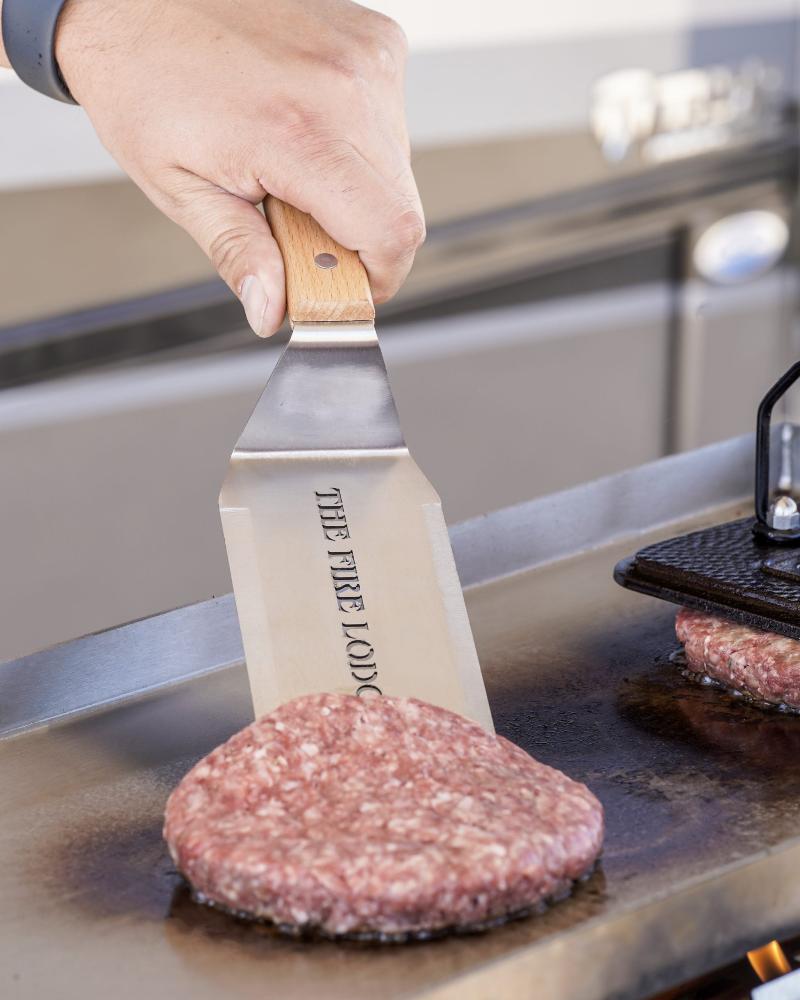 Flipping burgers on an Overlander grill