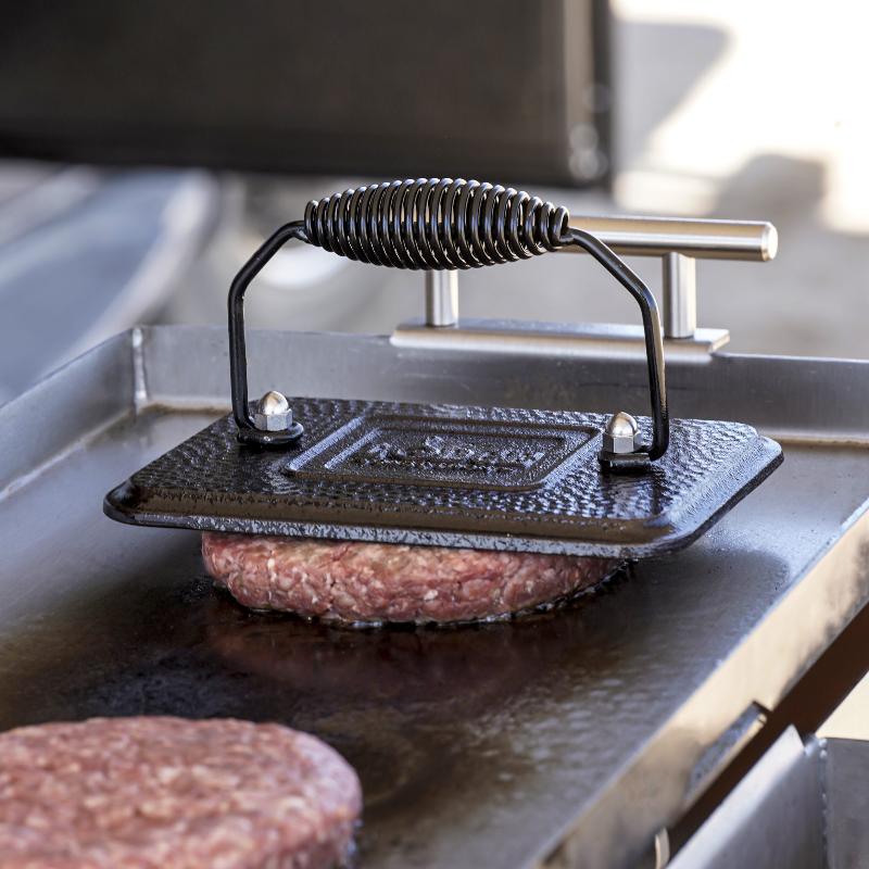 Cooking hamburgers on the Overlander fire pit.