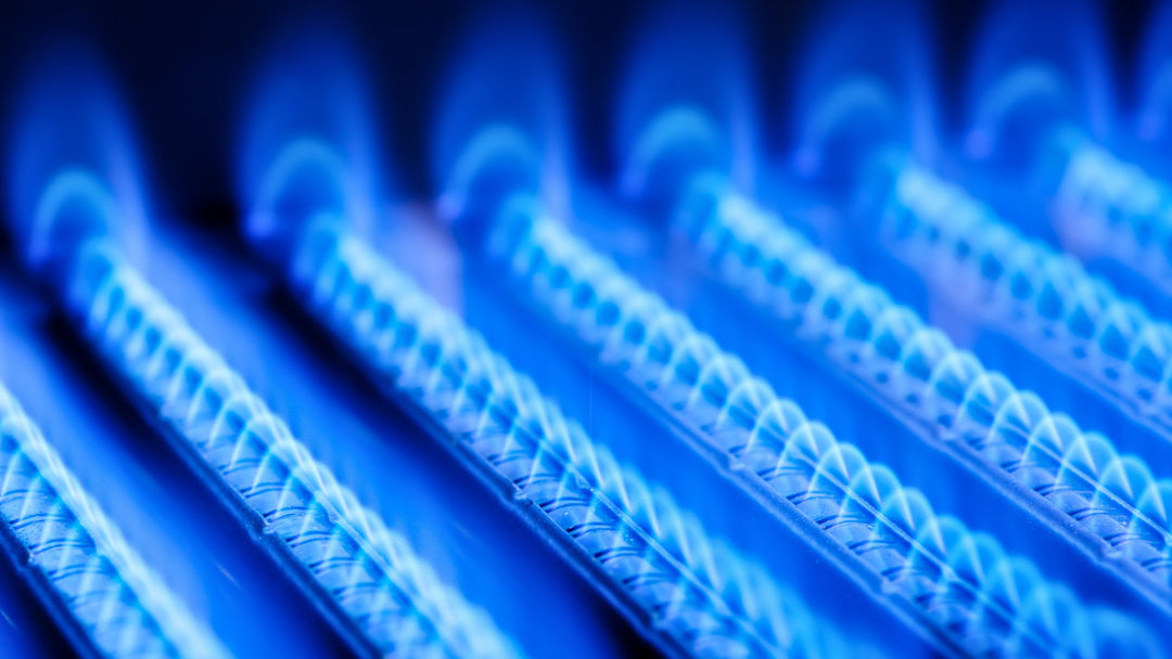the soft blue glow of natural gas burners